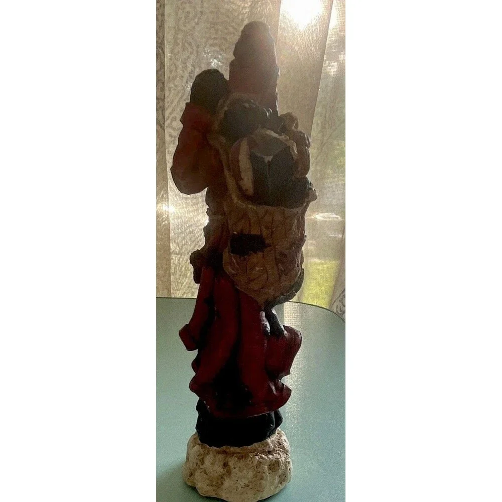 Vintage rustic, resin pencil Santa with toy bag